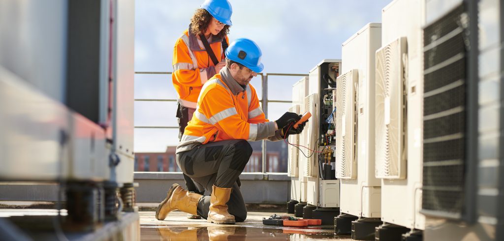 HVACR Technicians on root of high-rise